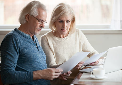 Elderly Couple Reviewing Disability Benefits