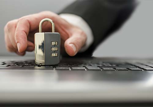 Male Hand Grabbing Padlock On Keyboard Identity Protection Concept