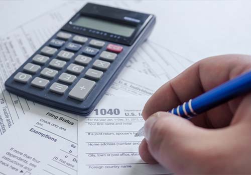Man Filling Out Tax Form 1040