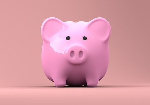 A pink pig piggy bank for retirement savings.