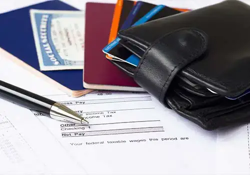 Social Security Card Next To Wallet With Credit Cards