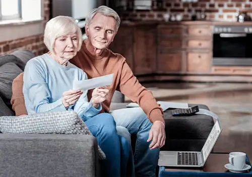 Grey Haired Man And His Wife Receiving Social Security Check