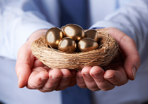 Man Holding Nest Full Of Golden Eggs Retirement Planning Concept