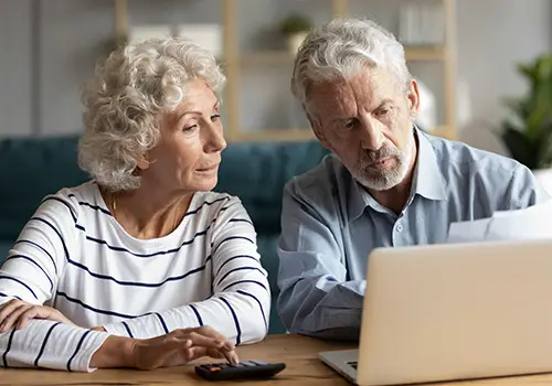 Senior Couple Reviewing Short Term Disability Insurance Paperwork