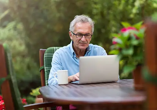 Senior Man Working on Laptop