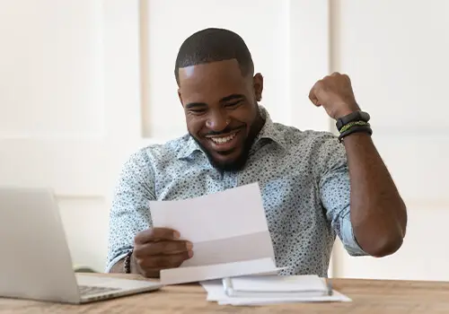 Happy Man Receiving Tax Credit Letter