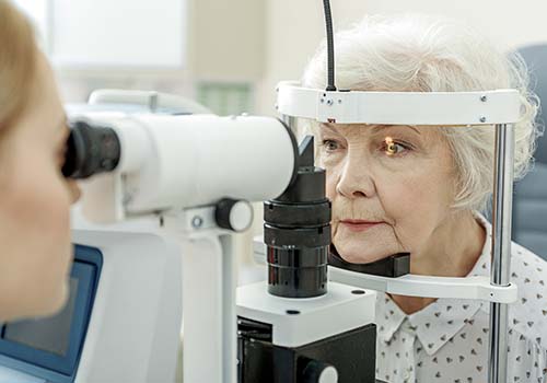 Elderly Woman Getting Eye Exam