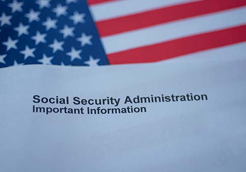 Letter From Social Security Administration On Top Of American Flag