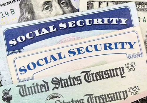 Macro View Of Social Security Cards Treasury Checks And Cash