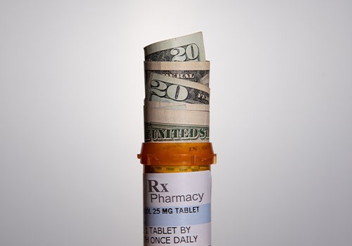 A few twenty dollar bills rolled up in a prescription pill bottle.
