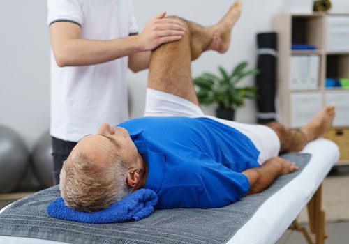 A man receiving chiropractic treatment.