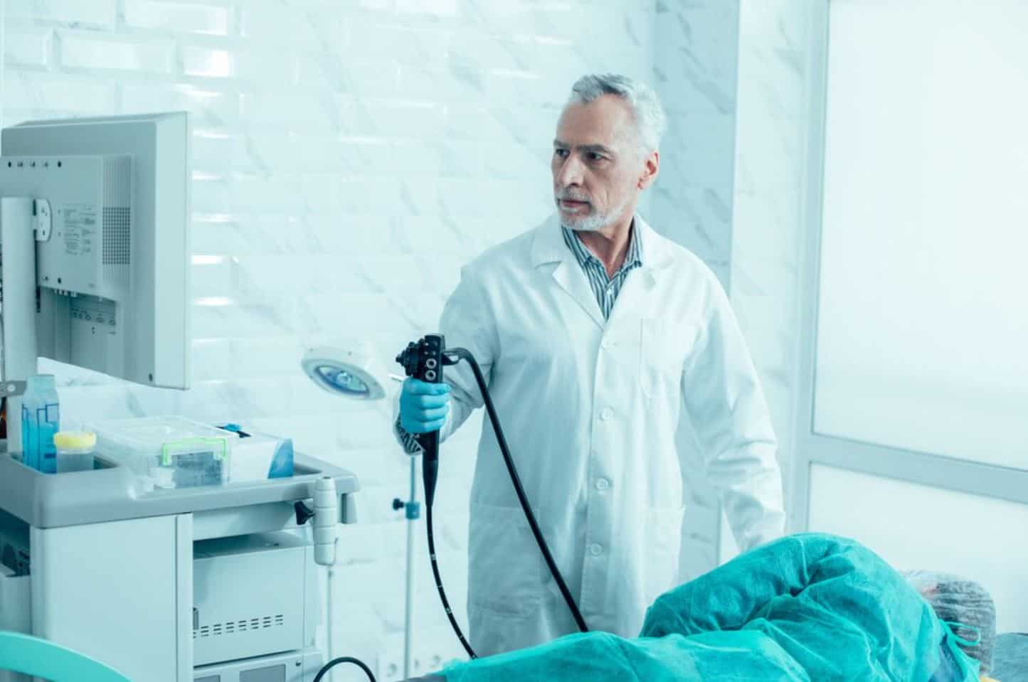 A doctor performing a colonoscopy covered by Medicare.